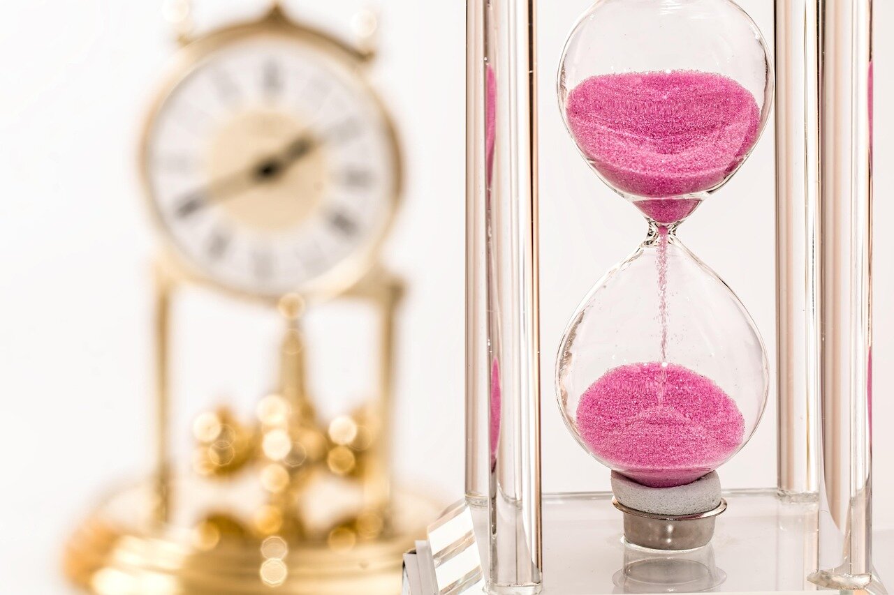 hour glass and a clock