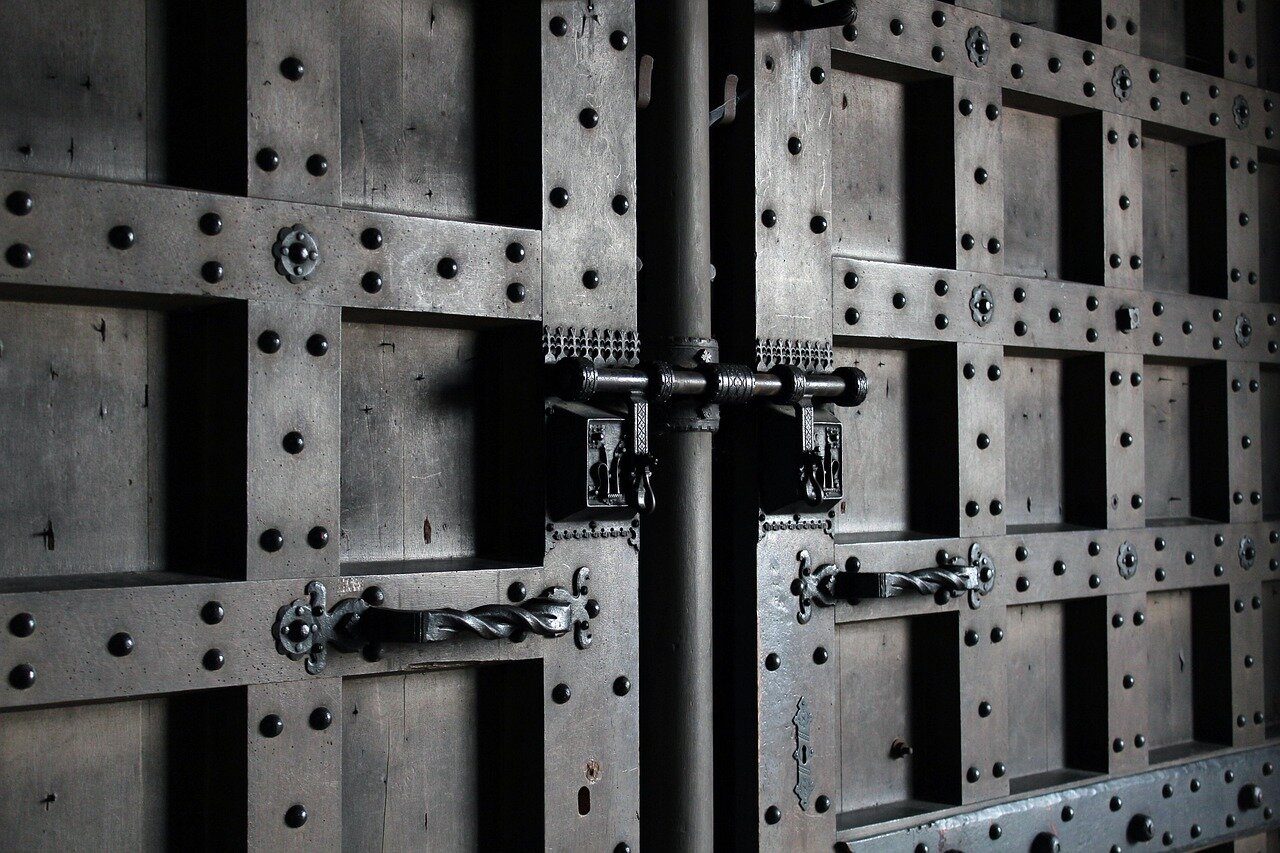 Metal secure castle doors Image of large metal doors with dead bolts