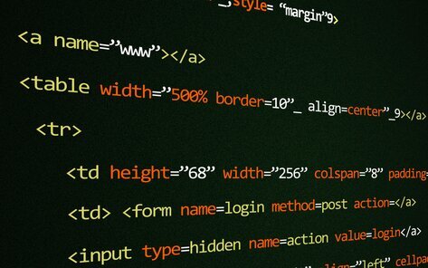 Laptop with html code on the screen