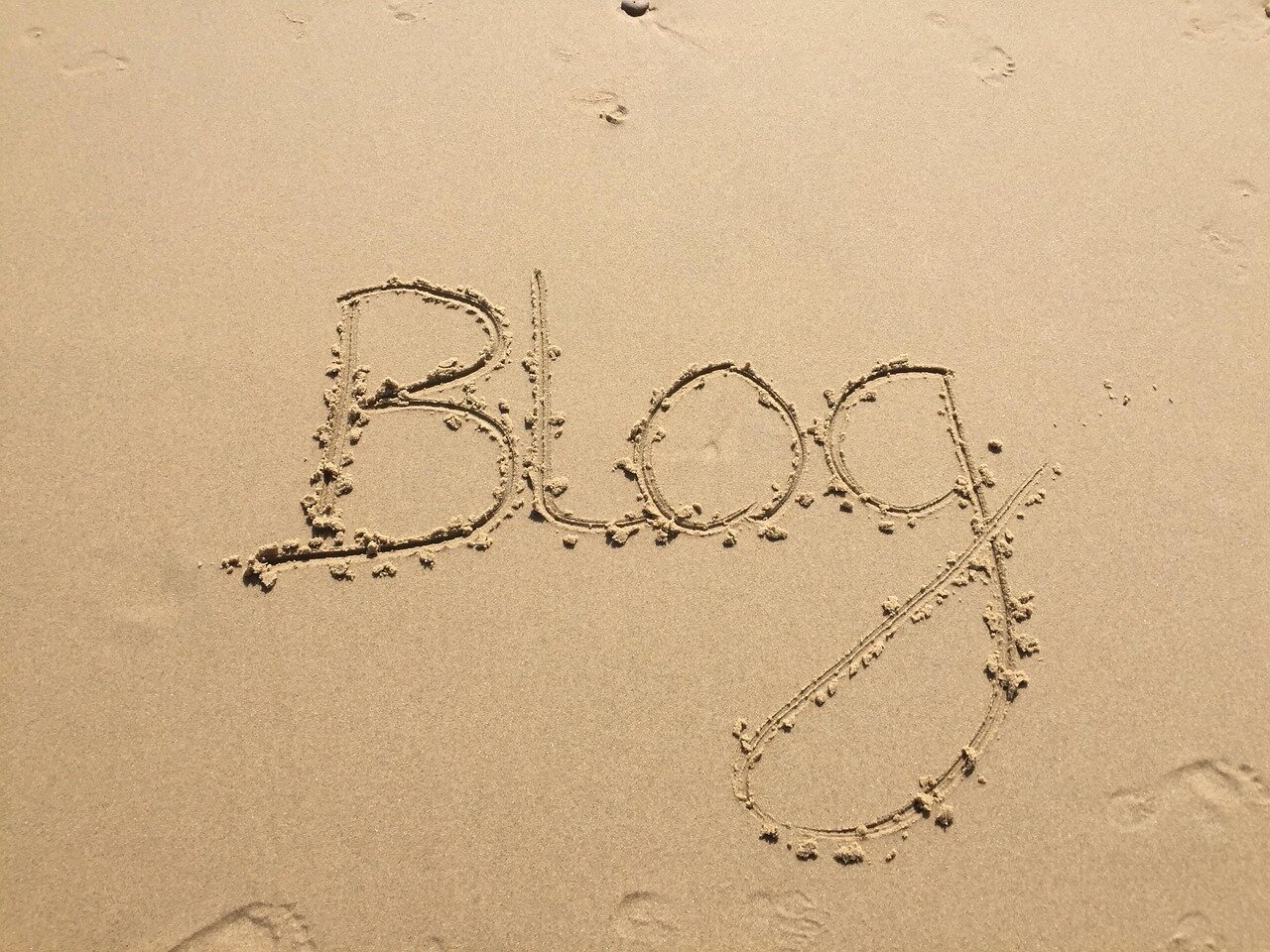 Image of the word Blog in the sand