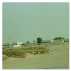 Photo of government buildings in the desert in Bahrain 1992